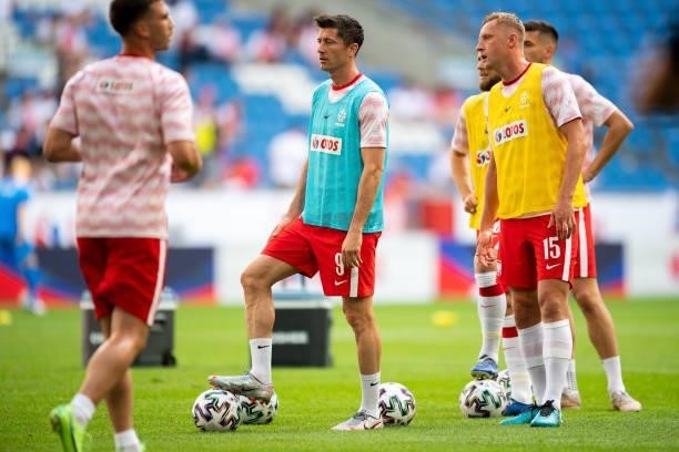 Robert Lewandowski of Poland and Kamil Glik of Poland warm up prior to the international friendly match between Poland and Iceland at Stadion Miejski...