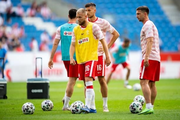 Tymoteusz Puchacz of Poland and Jakub Swierczok of Poland warm up prior to the international friendly match between Poland and Iceland at Stadion...