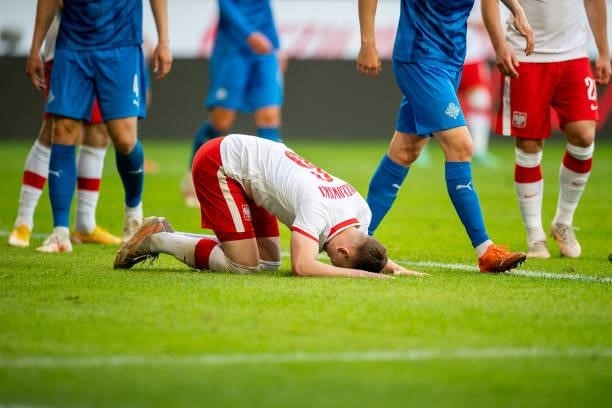 Kacper Kozlowski of Poland on the ground during the international friendly match between Poland and Iceland at Stadion Miejski on June 8, 2021 in...