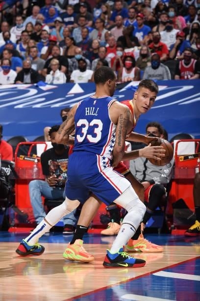 Bogdan Bogdanovic of the Atlanta Hawks handles the ball against George Hill of the Philadelphia 76ers during Round 2, Game 2 of the Eastern...