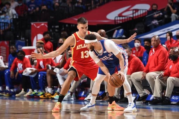 Seth Curry of the Philadelphia 76ers handles the ball against Bogdan Bogdanovic of the Atlanta Hawks during Round 2, Game 2 of the Eastern Conference...