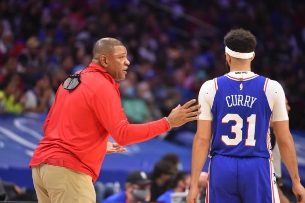 Head Coach Doc Rivers of the Seth Curry of the Philadelphia 76ers talk during Round 2, Game 2 of the Eastern Conference Playoffs on June 8, 2021 at...