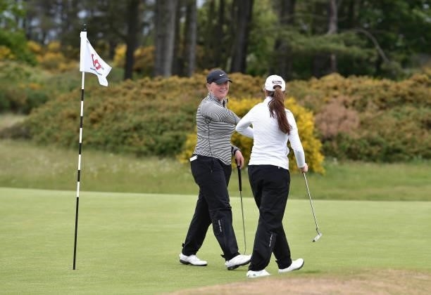 Chloe Goadby and Kate Lanigan elbow bump after the completition of their match during Day Three of the R&A Womens Amateur Championship at Kilmarnock...