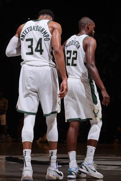 Giannis Antetokounmpo and Khris Middleton of the Milwaukee Bucks look on during Round 2, Game 2 of the 2021 NBA Playoffs on June 7, 2021 at Barclays...