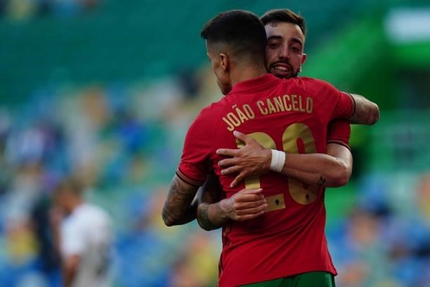 Bruno Fernandes of Portugal celebrates with teammate Joao Cancelo of Portugal after scoring a goal during the International Friendly match between...