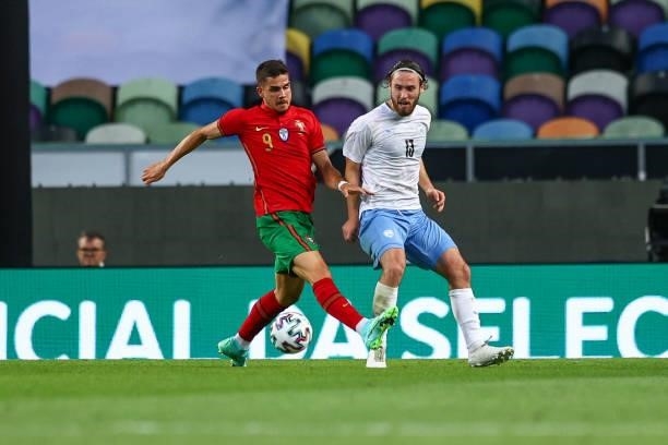 Andre Silva of Portugal and Eintracht Frankfurt vies with Ofri Arad of Israel and Maccabi Haifa FC during the international friendly match between...
