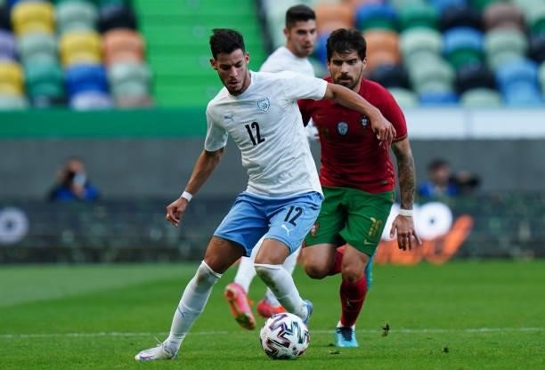 Sun Menachem of Israel with Ruben Neves of Portugal and Wolverhampton in action during the International Friendly match between Portugal and Israel...