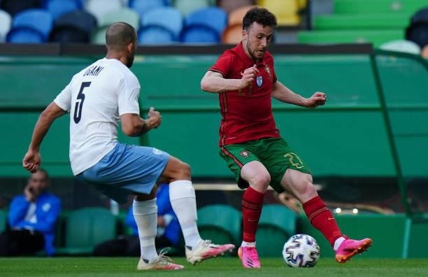 Diogo Jota of Portugal and Liverpool FC with Orel Dgani of Israel and Beitar Jerusalem in action during the International Friendly match between...