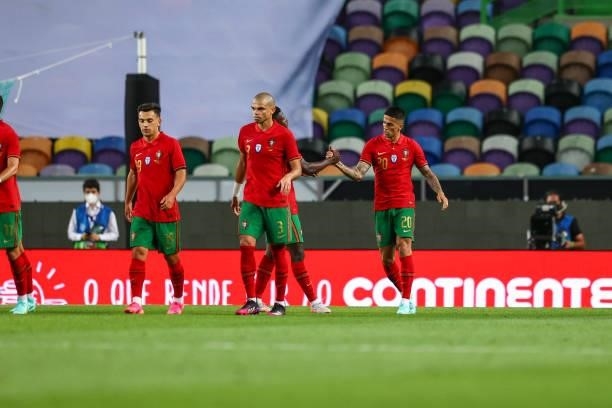 Joao Cancelo of Portugal and Manchester City celebrates scoring Portugal third goal with his team mates during the international friendly match...