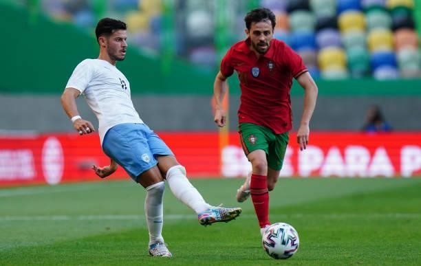 Sun Menachem of Israel with Bernardo Silva of Portugal and Manchester City in action during the International Friendly match between Portugal and...