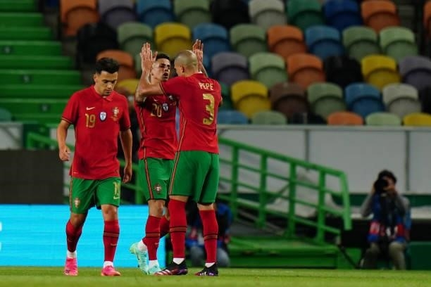 Joao Cancelo of Portugal and Manchester City celebrates with teammates after scoring a goal during the International Friendly match between Portugal...