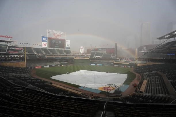 Rainbow forms over Target Field as rain comes down before the start of the game between the New York Yankees and Minnesota Twins at Target Field on...