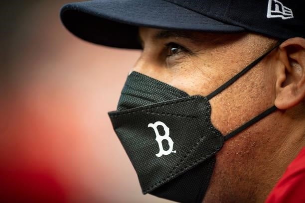 Manager Alex Cora of the Boston Red Sox wears a mask as he looks on during the first inning of a game against the Houston Astros on June 9, 2021 at...