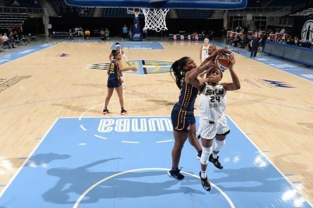 Teaira McCowan of the Indiana Fever blocks the ball against Ruthy Hebard of the Chicago Sky during the game on June 9, 2021 at the Wintrust Arena in...