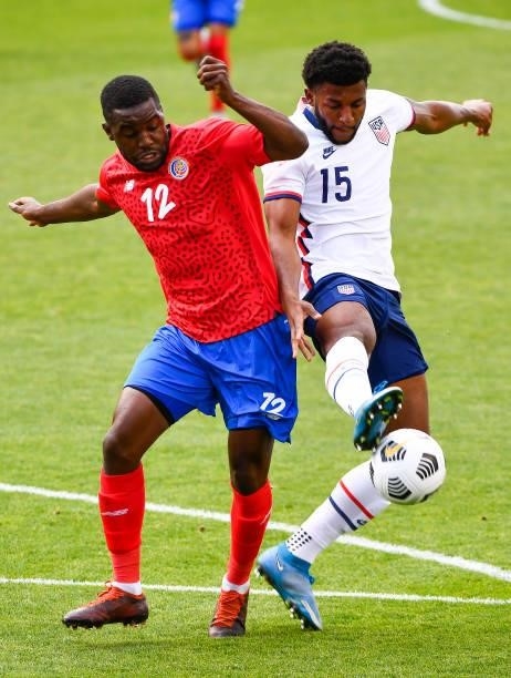 Mark McKenzie of the United States fights for the ball with Joel Campbell of Costa Rica during a game at Rio Tinto Stadium on June 09, 2021 in Sandy,...