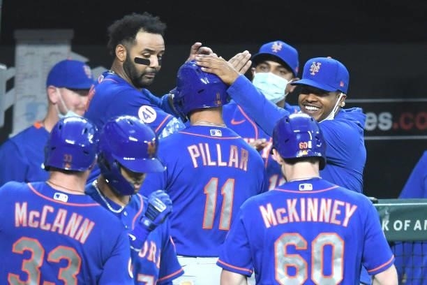 Kevin Pillar of the New York Mets celebrates with teammates after hitting a three-run home run in the third inning during a game against the...