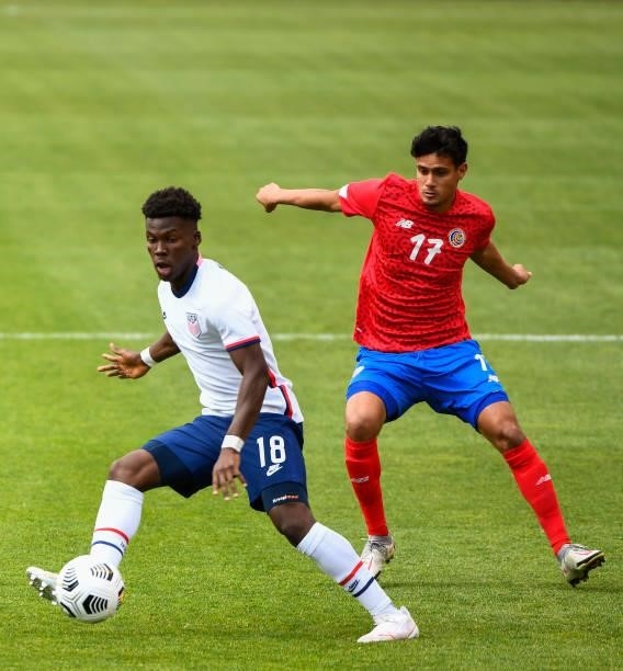 Yunus Musah of the United States controls the ball in front of Yeltsin Tejeda of Costa Rica during a game at Rio Tinto Stadium on June 09, 2021 in...