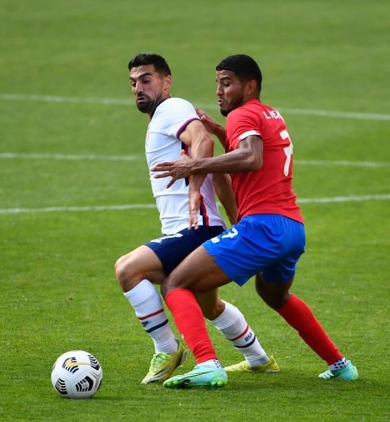 Sebastian Lletget of the United States fights for the ball with Johan Venegas of Costa Rica during a game at Rio Tinto Stadium on June 09, 2021 in...