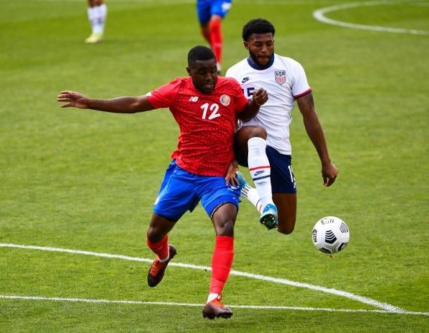 Mark McKenzie of the United States fights for the ball with Joel Campbell of Costa Rica during a game at Rio Tinto Stadium on June 09, 2021 in Sandy,...