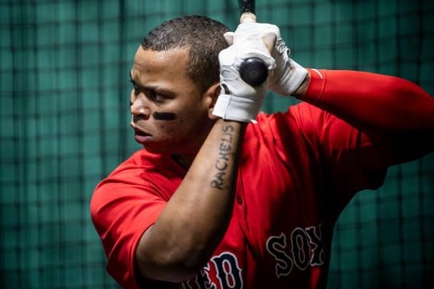 Rafael Devers of the Boston Red Sox takes batting practice in the batting cage before a game against the Houston Astros on June 9, 2021 at Fenway...