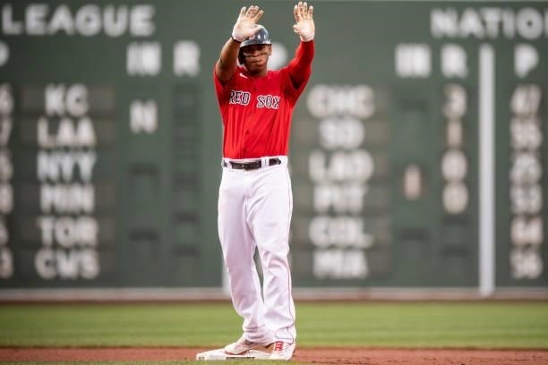 Rafael Devers of the Boston Red Sox reacts after hitting a double during the first inning of a game against the Houston Astros on June 9, 2021 at...