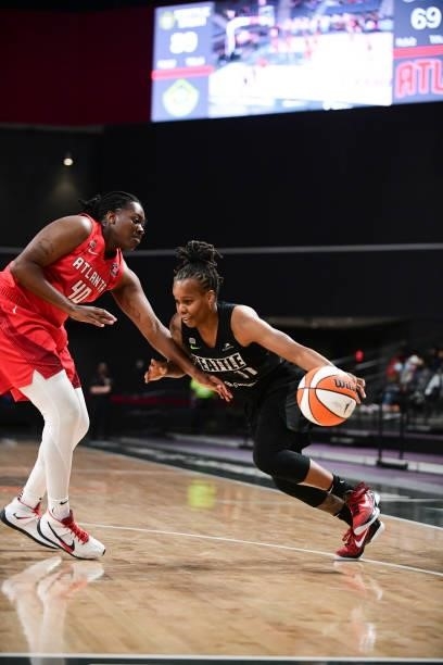 Epiphanny Prince of the Seattle Storm handles the ball as Shekinna Stricklen of the Atlanta Dream plays defense during the game on June 9, 2021 at...