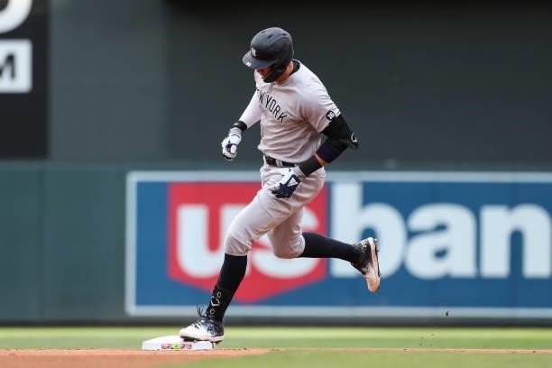 Aaron Judge of the New York Yankees rounds the bases after hitting a solo home run against the Minnesota Twins in the first inning of the game at...