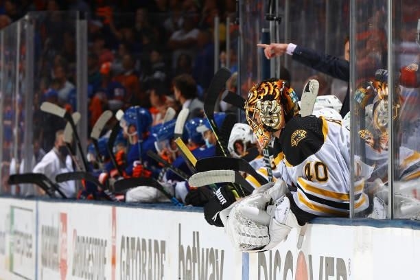 Tuukka Rask of the Boston Bruins looks on from the bench after he is pulled against the New York Islanders during the third period in Game Six of the...
