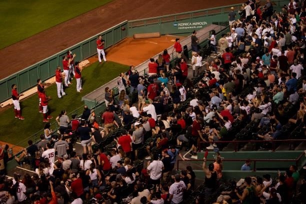 Members of the Boston Red Sox bullpen applaud during a Hats Off To Heroes military appreciation ceremony during a game against the Houston Astros on...