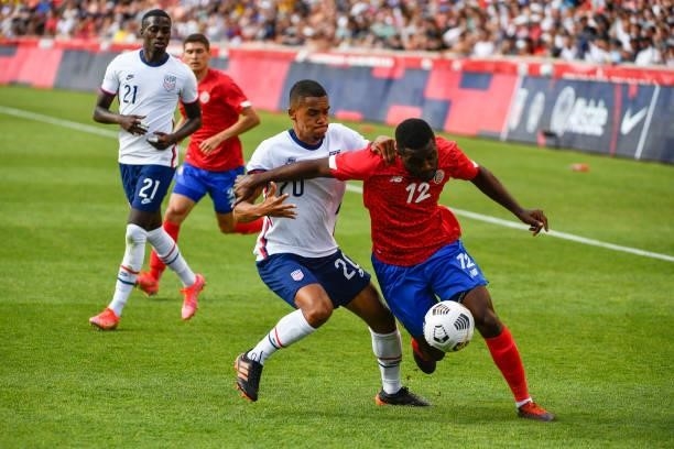 Joel Campbell of Costa Rica controls the ball in front of Reggie Cannon of the United States during a game at Rio Tinto Stadium on June 09, 2021 in...
