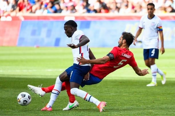 Tim Weah of the United States fights for the ball with Celso Borges of Costa Rica during a game at Rio Tinto Stadium on June 09, 2021 in Sandy, Utah.
