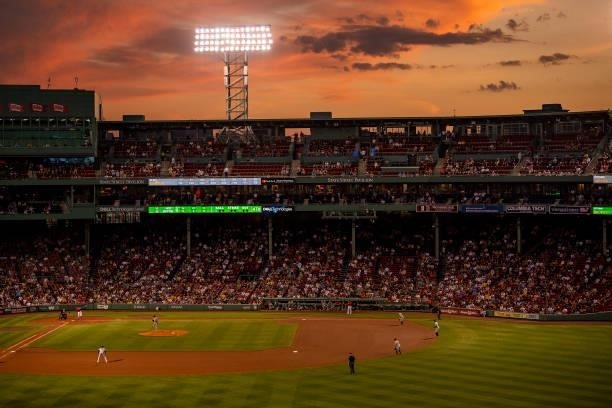 General view as the sun sets during a game between the Boston Red Sox and the Houston Astros on June 9, 2021 at Fenway Park in Boston, Massachusetts.