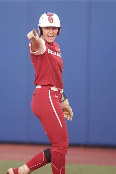 Kinzie Hansen of the Oklahoma Sooners celebrates a base hit during the Division I Women's Softball Championship held at ASA Hall of Fame Stadium on...