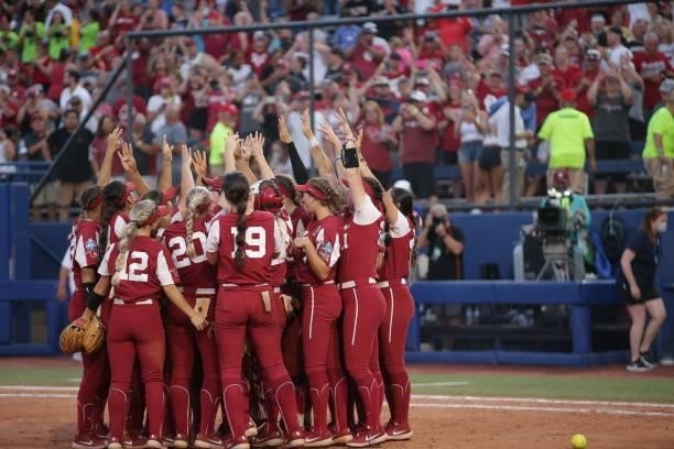 The Oklahoma Sooners celebrate their win in Game Two during the Division I Women's Softball Championship held at ASA Hall of Fame Stadium on June 9,...