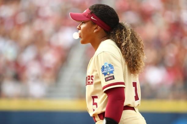 Jahni Kerr of the Florida St. Seminoles blows a bubble gum bubble against the Oklahoma Sooners during the Division I Women's Softball Championship...