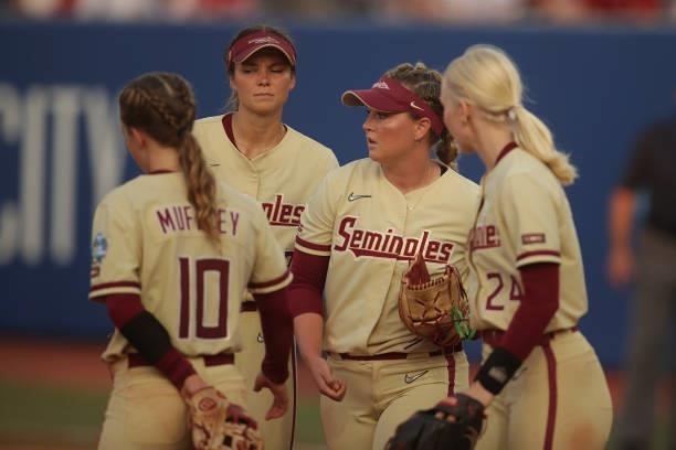 The Florida Seminoles gather at the pitchers mound during the Division I Women's Softball Championship held at ASA Hall of Fame Stadium on June 9,...