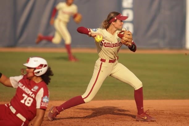 Devyn Flaherty of the Florida St. Seminoles turns the double play on Jocelyn Alo of the Oklahoma Sooners during the Division I Women's Softball...