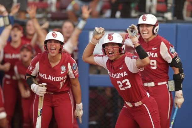 Tiare Jennings of the Oklahoma Sooners celebrates after scoring on a home run hit by Jocelyn Alo of the Oklahoma Sooners during the Division I...