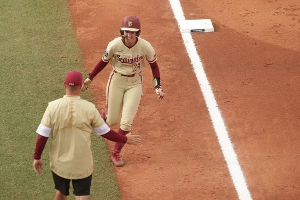 Sydney Sherrill of the Florida St. Seminoles heads for home base during the Division I Women's Softball Championship held at ASA Hall of Fame Stadium...