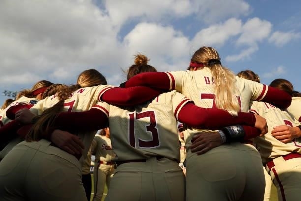 The Florida St. Seminoles huddle before the game against the Oklahoma Sooners during the Division I Women's Softball Championship held at ASA Hall of...