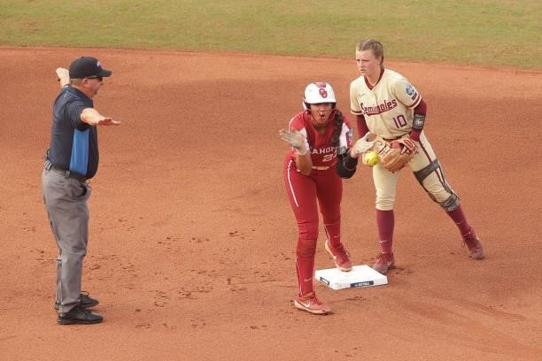 Tiare Jennings of the Oklahoma Sooners celebrates beating Josie Muffley of the Florida St. Seminoles to second base during the Division I Women's...