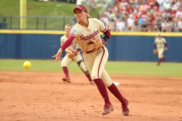 Devyn Flaherty of the Florida St. Seminoles fields the ball against the Oklahoma Sooners during the Division I Women's Softball Championship held at...