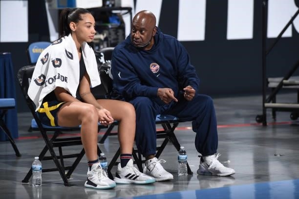 Kysre Gondrezick talks to her Assistant Coach, Steve Smith of the Indiana Fever before the game against the Chicago Sky on June 9, 2021 at the...