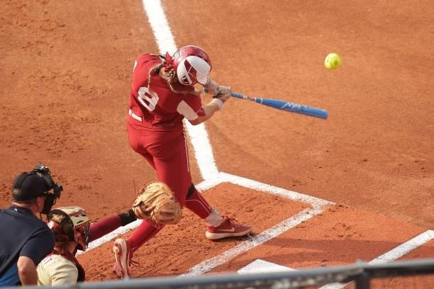 Kinzie Hansen of the Oklahoma Sooners connects with the ball during the Division I Women's Softball Championship held at ASA Hall of Fame Stadium on...