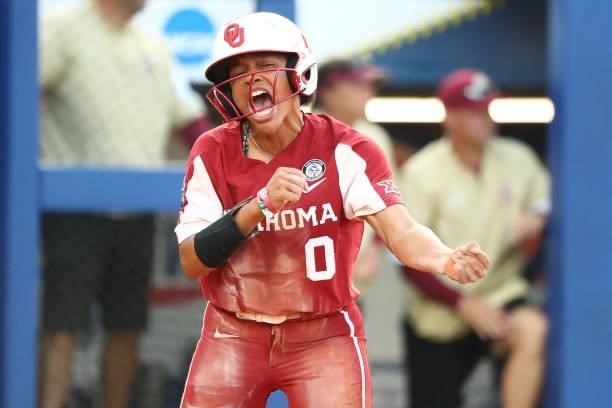 Rylie Boone of the Oklahoma Sooners reacts after scoring against the Florida St. Seminoles during the Division I Women's Softball Championship held...