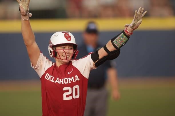 Jana Johns of the Oklahoma Sooners celebrates a home run during the Division I Women's Softball Championship held at ASA Hall of Fame Stadium on June...
