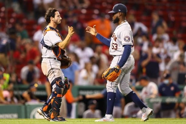 Garrett Stubbs of the Houston Astros celebrates with Cristian Javier after a win over the Boston Red Sox at Fenway Park on June 9, 2021 in Boston,...