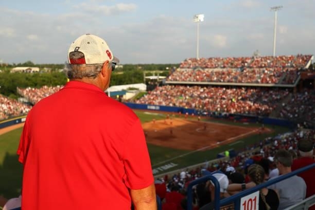 Fan looks on during the game between the Oklahoma Sooners and the Florida St. Seminoles during the Division I Women's Softball Championship held at...