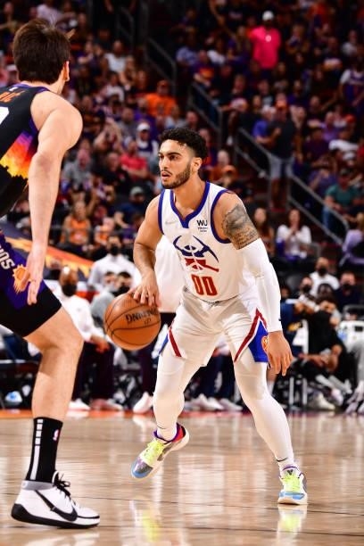 Markus Howard of the Denver Nuggets dribbles the ball during Round 2, Game 2 of the 2021 NBA Playoffs on June 9, 2021 at Phoenix Suns Arena in...