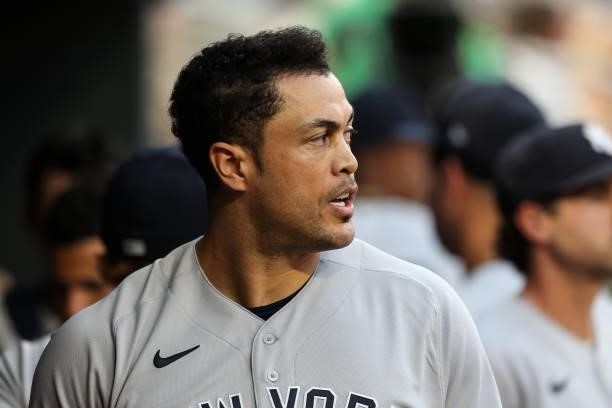 Giancarlo Stanton of the New York Yankees looks on after hitting a two-run home run against the Minnesota Twins in the fifth inning of the game at...